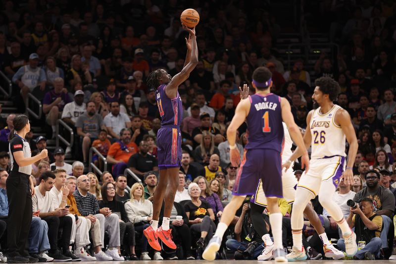 PHOENIX, ARIZONA - FEBRUARY 25: Bol Bol #11 of the Phoenix Suns puts up a three-point shot against the Los Angeles Lakers during the first half of the NBA game at Footprint Center on February 25, 2024 in Phoenix, Arizona. NOTE TO USER: User expressly acknowledges and agrees that, by downloading and or using this photograph, User is consenting to the terms and conditions of the Getty Images License Agreement.  (Photo by Christian Petersen/Getty Images)