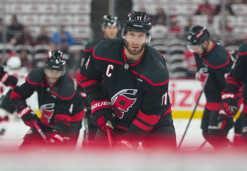 Apr 29, 2025; Raleigh, North Carolina, USA; Carolina Hurricanes center Jordan Staal (11) looks on during the warmups before the game against the New Jersey Devils in game five of the first round of the 2025 Stanley Cup Playoffs at Lenovo Center. Mandatory Credit: James Guillory-Imagn Images