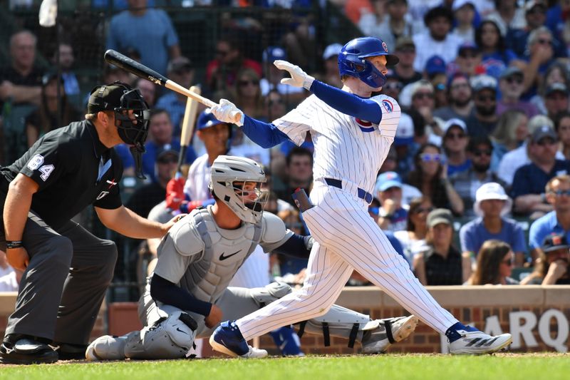 Aug 22, 2024; Chicago, Illinois, USA; Chicago Cubs center fielder Pete Crow-Armstrong (52) hits a two-run double during the seventh inning against the Detroit Tigers at Wrigley Field. Mandatory Credit: Patrick Gorski-USA TODAY Sports