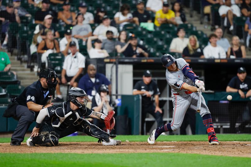 Jul 8, 2024; Chicago, Illinois, USA; Minnesota Twins third baseman Brooks Lee (72) hits an RBI-single against the Chicago White Sox during the 11th inning at Guaranteed Rate Field. Mandatory Credit: Kamil Krzaczynski-USA TODAY Sports