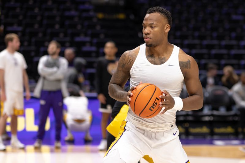 Jan 21, 2023; Baton Rouge, Louisiana, USA;  LSU Tigers forward KJ Williams (12) warms up before a game against the Tennessee Volunteers at Pete Maravich Assembly Center. Mandatory Credit: Stephen Lew-USA TODAY Sports