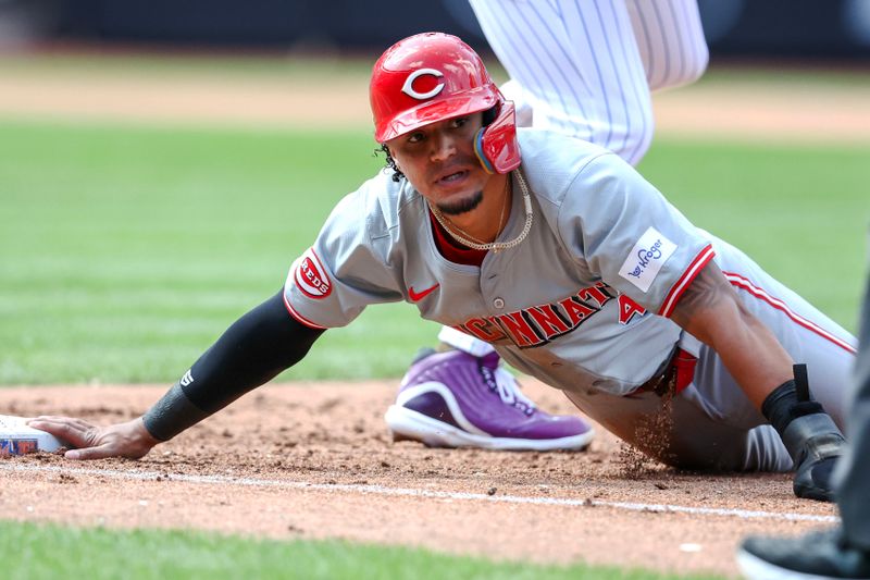Sep 8, 2024; New York City, New York, USA;  Cincinnati Reds designated hitter Santiago Espinal (4) is picked off at first base in the fifth inning against the New York Mets at Citi Field. Mandatory Credit: Wendell Cruz-Imagn Images