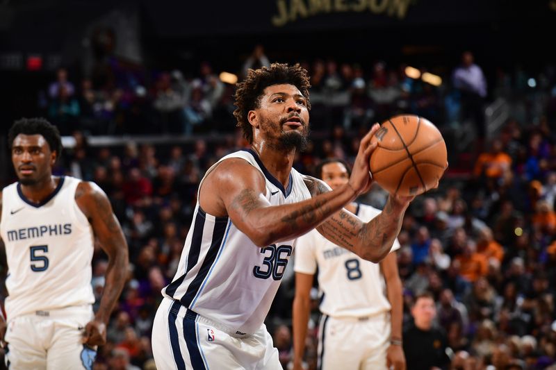 PHOENIX, AZ - JANUARY  7: Marcus Smart #36 of the Memphis Grizzlies shoots a free throw during the game against the Phoenix Suns on January 7, 2024 at Footprint Center in Phoenix, Arizona. NOTE TO USER: User expressly acknowledges and agrees that, by downloading and or using this photograph, user is consenting to the terms and conditions of the Getty Images License Agreement. Mandatory Copyright Notice: Copyright 2024 NBAE (Photo by Kate Frese/NBAE via Getty Images)