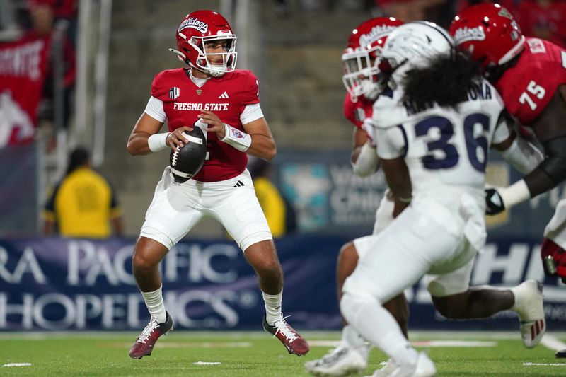 Sep 30, 2023; Fresno, California, USA; Fresno State Bulldogs quarterback Mikey Keene (1) looks to throw a pass against the Nevada Wolf Pack in the first quarter at Valley Children's Stadium. Mandatory Credit: Cary Edmondson-USA TODAY Sports