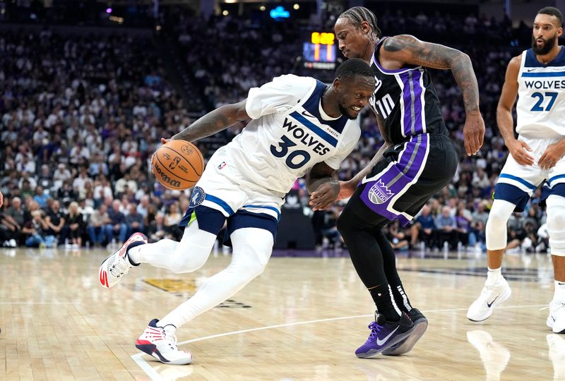 SACRAMENTO, CALIFORNIA - OCTOBER 24: Julius Randle #30 of the Minnesota Timberwolves dribbles the ball around DeMar DeRozan #10 of the Sacramento Kings during the second quarter at Golden 1 Center on October 24, 2024 in Sacramento, California. NOTE TO USER: User expressly acknowledges and agrees that, by downloading and or using this photograph, User is consenting to the terms and conditions of the Getty Images License Agreement. (Photo by Thearon W. Henderson/Getty Images)