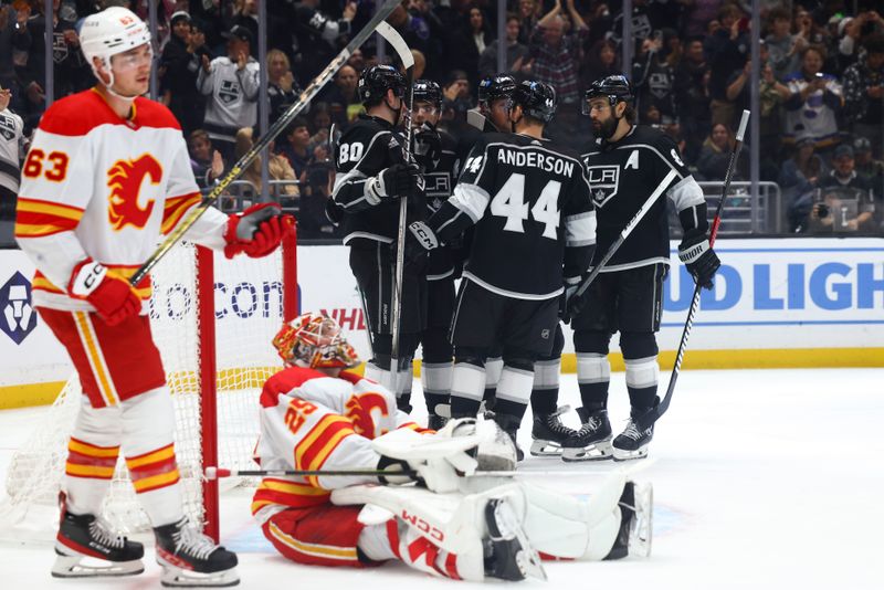 Dec 23, 2023; Los Angeles, California, USA; Los Angeles Kings right wing Alex Laferriere (78) celebrates with his teammates after scoring a goal against the Calgary Flames during the second period at Crypto.com Arena. Mandatory Credit: Jessica Alcheh-USA TODAY Sports