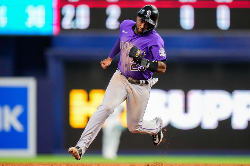 Jul 23, 2023; Miami, Florida, USA; Colorado Rockies left fielder Jurickson Profar (29) rounds second base against the Miami Marlins during the third inning at loanDepot Park. Mandatory Credit: Rich Storry-USA TODAY Sports