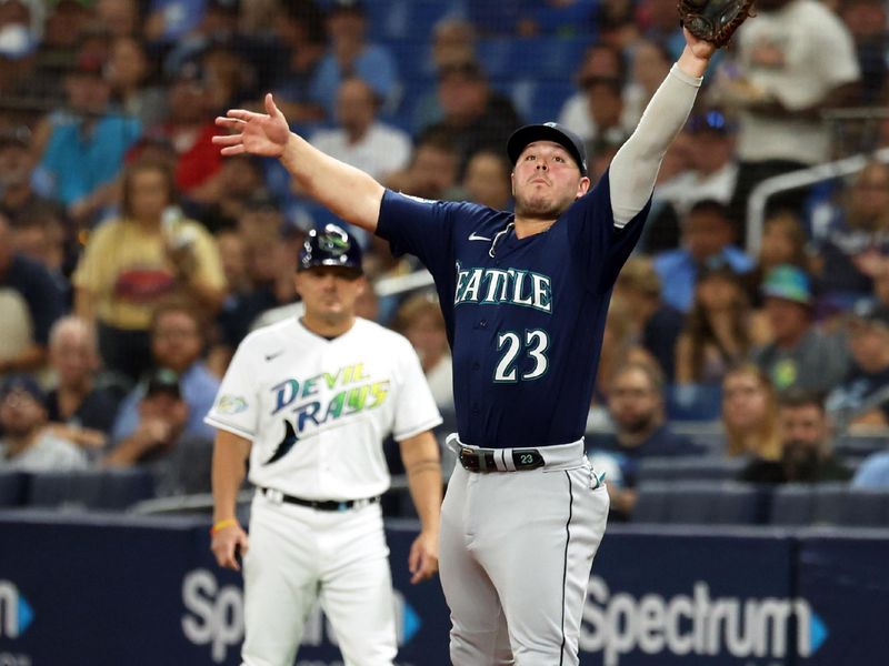 Sep 8, 2023; St. Petersburg, Florida, USA; Seattle Mariners first baseman Ty France (23) catches the ball against the Tampa Bay Rays during the second inning at Tropicana Field. Mandatory Credit: Kim Klement Neitzel-USA TODAY Sports