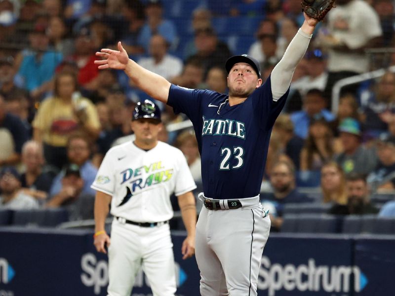 Sep 8, 2023; St. Petersburg, Florida, USA; Seattle Mariners first baseman Ty France (23) catches the ball against the Tampa Bay Rays during the second inning at Tropicana Field. Mandatory Credit: Kim Klement Neitzel-USA TODAY Sports