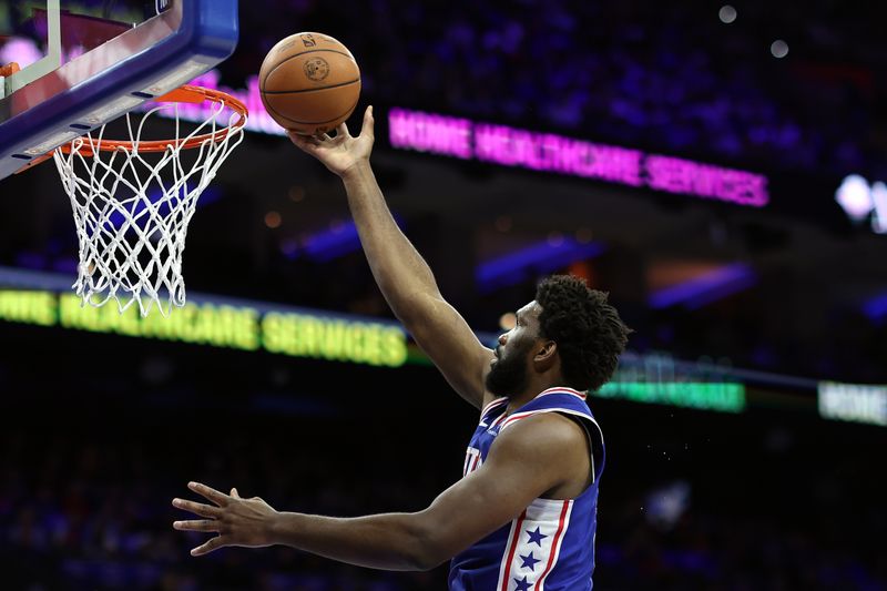 PHILADELPHIA, PENNSYLVANIA - OCTOBER 29: Joel Embiid #21 of the Philadelphia 76ers shoots a lay up during the first quarter against the Portland Trail Blazers at Wells Fargo Center on October 29, 2023 in Philadelphia, Pennsylvania. NOTE TO USER: User expressly acknowledges and agrees that, by downloading and or using this photograph, User is consenting to the terms and conditions of the Getty Images License Agreement. (Photo by Tim Nwachukwu/Getty Images)