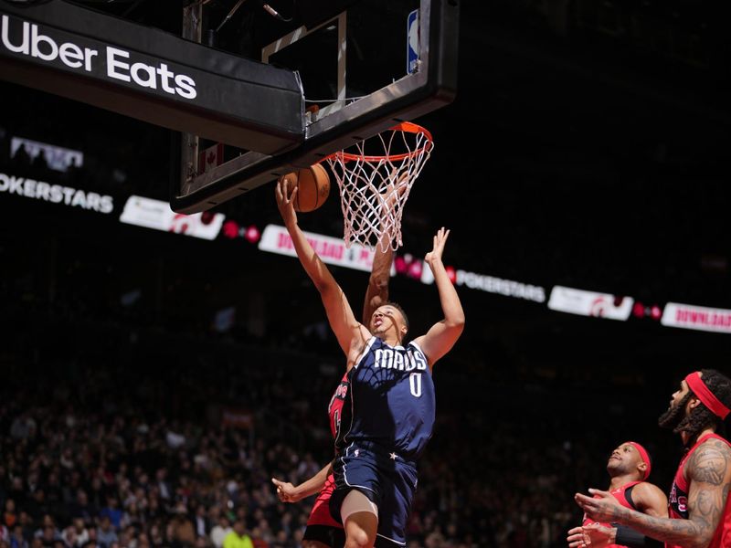 TORONTO, CANADA - FEBRUARY 28: Dante Exum #0 of the Dallas Mavericks drives to the basket during the game against the Toronto Raptors on February 28, 2024 at the Scotiabank Arena in Toronto, Ontario, Canada.  NOTE TO USER: User expressly acknowledges and agrees that, by downloading and or using this Photograph, user is consenting to the terms and conditions of the Getty Images License Agreement.  Mandatory Copyright Notice: Copyright 2024 NBAE (Photo by Mark Blinch/NBAE via Getty Images)