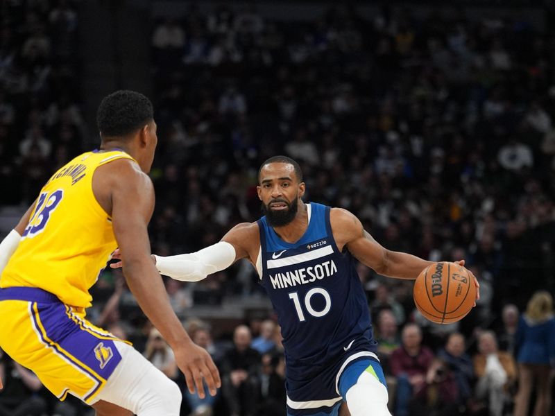 MINNEAPOLIS, MN -  DECEMBER 13: Mike Conley #10 of the Minnesota Timberwolves dribbles the ball during the game against the Los Angeles Lakers on December 13, 2024 at Target Center in Minneapolis, Minnesota. NOTE TO USER: User expressly acknowledges and agrees that, by downloading and or using this Photograph, user is consenting to the terms and conditions of the Getty Images License Agreement. Mandatory Copyright Notice: Copyright 2024 NBAE (Photo by Jordan Johnson/NBAE via Getty Images)