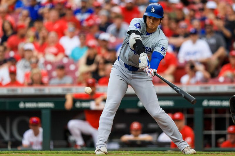 May 26, 2024; Cincinnati, Ohio, USA; Los Angeles Dodgers designated hitter Shohei Ohtani (17) bats against the Cincinnati Reds in the fourth inning at Great American Ball Park. Mandatory Credit: Katie Stratman-USA TODAY Sports