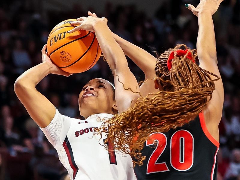 Feb 26, 2023; Columbia, South Carolina, USA; Georgia Lady Bulldogs forward Jordan Isaacs (20) blocks the shot of South Carolina Gamecocks guard Zia Cooke (1) in the first half at Colonial Life Arena. Mandatory Credit: Jeff Blake-USA TODAY Sports