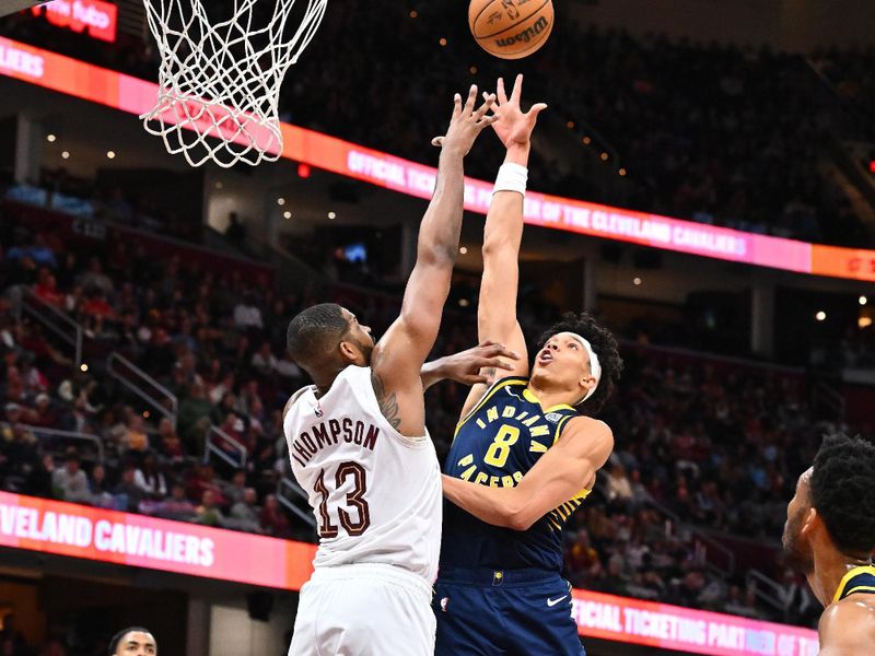 CLEVELAND, OHIO - APRIL 13: Enrique Freeman #8 of the Indiana Pacers shoots over Tristan Thompson #13 of the Cleveland Cavaliers during the third quarter at Rocket Arena on April 13, 2025 in Cleveland, Ohio. The Pacers defeated the Cavaliers 126-118 in double overtime. NOTE TO USER: User expressly acknowledges and agrees that, by downloading and or using this photograph, User is consenting to the terms and conditions of the Getty Images License Agreement. (Photo by Jason Miller/Getty Images)