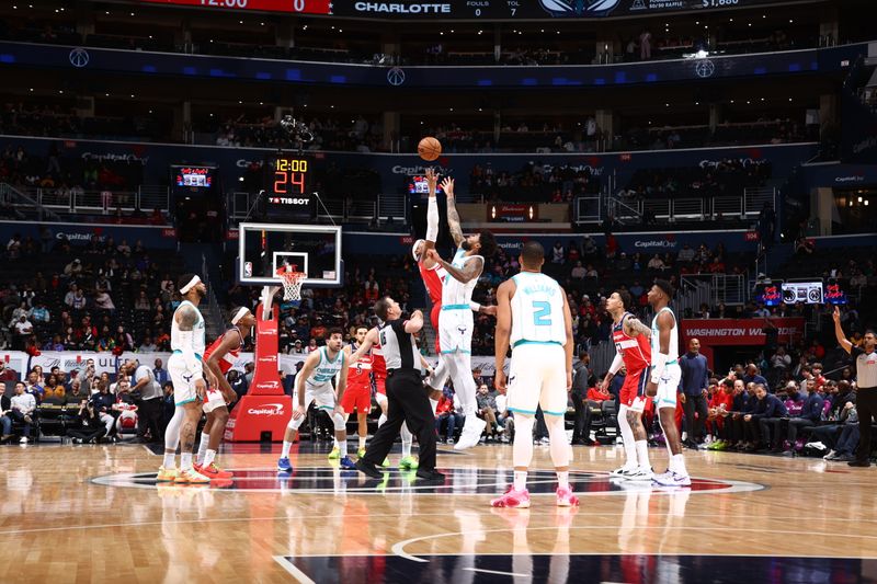 WASHINGTON, DC -? MARCH 8: Richaun Holmes #22 of the Washington Wizards and Nick Richards #4 of the Charlotte Hornets go up for the opening tip off on March 8, 2024 at Capital One Arena in Washington, DC. NOTE TO USER: User expressly acknowledges and agrees that, by downloading and or using this Photograph, user is consenting to the terms and conditions of the Getty Images License Agreement. Mandatory Copyright Notice: Copyright 2024 NBAE (Photo by Kenny Giarla/NBAE via Getty Images)