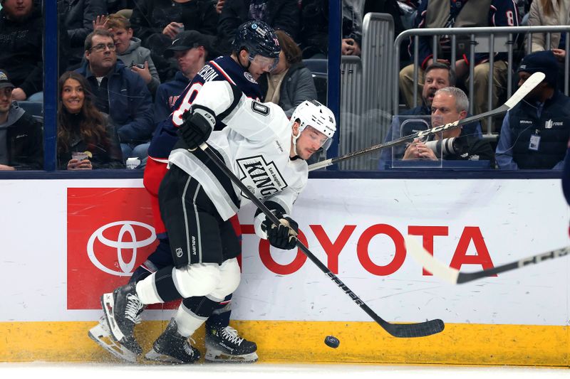 Jan 25, 2025; Columbus, Ohio, USA;  Los Angeles Kings left wing Tanner Jeannot (10) controls the puck against Columbus Blue Jackets defenseman Damon Severson (78) during the first period at Nationwide Arena. Mandatory Credit: Joseph Maiorana-Imagn Images