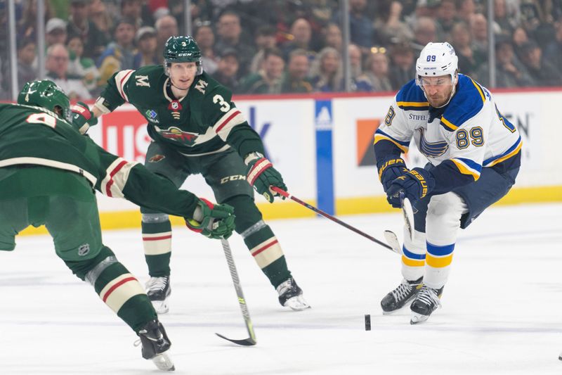 Apr 8, 2023; Saint Paul, Minnesota, USA; St. Louis Blues left wing Pavel Buchnevich (89) skates, defended by Minnesota Wild defenseman John Klingberg (3) and defenseman Jon Merrill (4) at Xcel Energy Center. Mandatory Credit: Matt Blewett-USA TODAY Sports