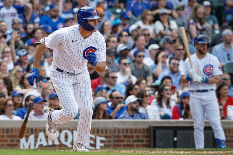 May 5, 2023; Chicago, Illinois, USA; Chicago Cubs first baseman Matt Mervis (22) watches his RBI-single against the Miami Marlins during the eight inning at Wrigley Field. Mandatory Credit: Kamil Krzaczynski-USA TODAY Sports