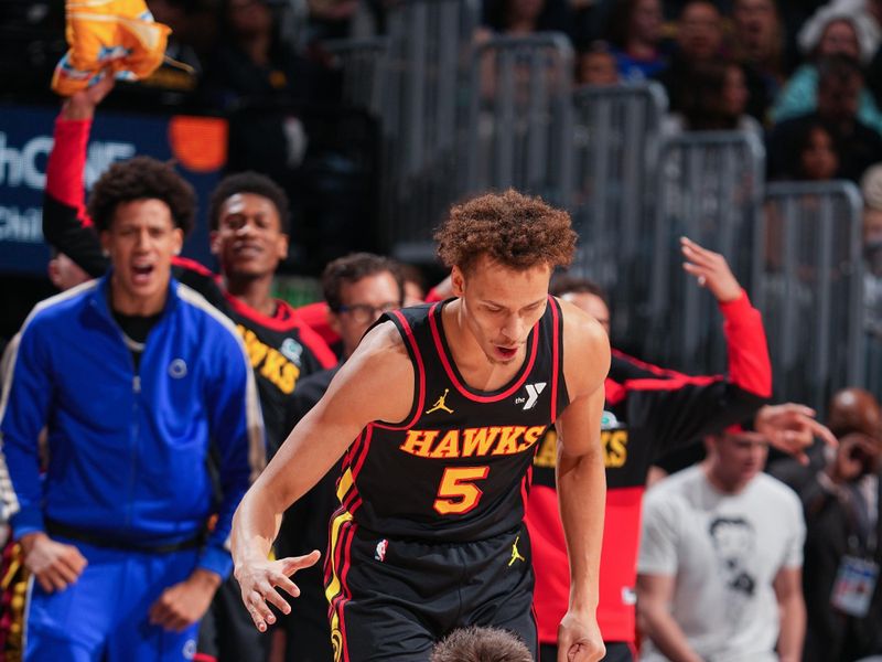 DENVER, CO - JANUARY 1: Dyson Daniels #5 and Vit Krejci #27 of the Atlanta Hawks celebrates during the game against the Denver Nuggets on January 1, 2025 at Ball Arena in Denver, Colorado. NOTE TO USER: User expressly acknowledges and agrees that, by downloading and/or using this Photograph, user is consenting to the terms and conditions of the Getty Images License Agreement. Mandatory Copyright Notice: Copyright 2025 NBAE (Photo by Garrett Ellwood/NBAE via Getty Images)