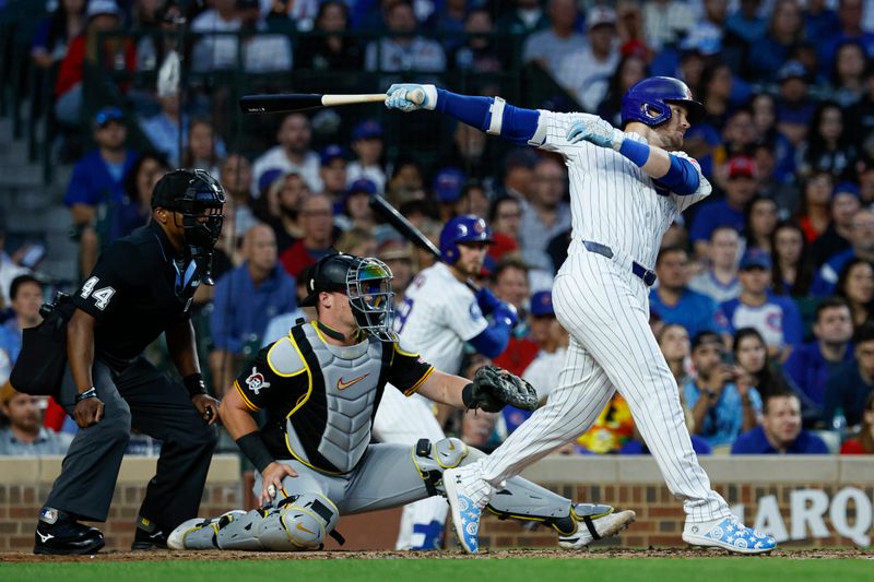 Sep 2, 2024; Chicago, Illinois, USA; Chicago Cubs outfielder Ian Happ (8) singles against the Pittsburgh Pirates during the third inning at Wrigley Field. Mandatory Credit: Kamil Krzaczynski-USA TODAY Sports