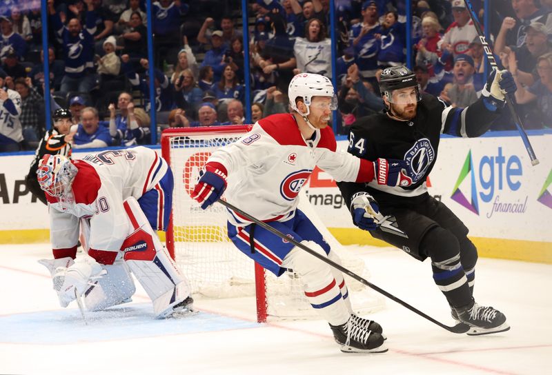 Mar 2, 2024; Tampa, Florida, USA;  Tampa Bay Lightning center Tyler Motte (64) celebrates his goal on Montreal Canadiens goaltender Cayden Primeau (30) during the third period at Amalie Arena. Mandatory Credit: Kim Klement Neitzel-USA TODAY Sports