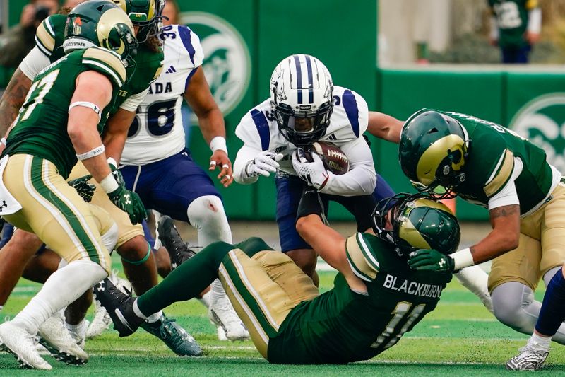 Nov 18, 2023; Fort Collins, Colorado, USA;  Nevada Wolf Pack wide receiver Jamaal Bell (3) runs against a host of Colorado State Rams defenders at Sonny Lubick Field at Canvas Stadium. Mandatory Credit: Michael Madrid-USA TODAY Sports