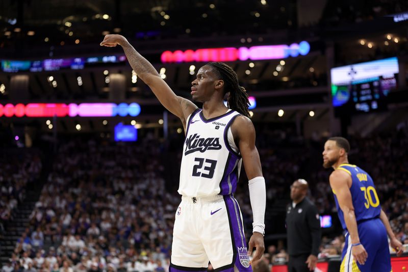 SACRAMENTO, CALIFORNIA - APRIL 16: Keon Ellis #23 of the Sacramento Kings watches his shot against the Golden State Warriors in the second half during the Play-In Tournament at Golden 1 Center on April 16, 2024 in Sacramento, California.  NOTE TO USER: User expressly acknowledges and agrees that, by downloading and or using this photograph, User is consenting to the terms and conditions of the Getty Images License Agreement.  (Photo by Ezra Shaw/Getty Images)