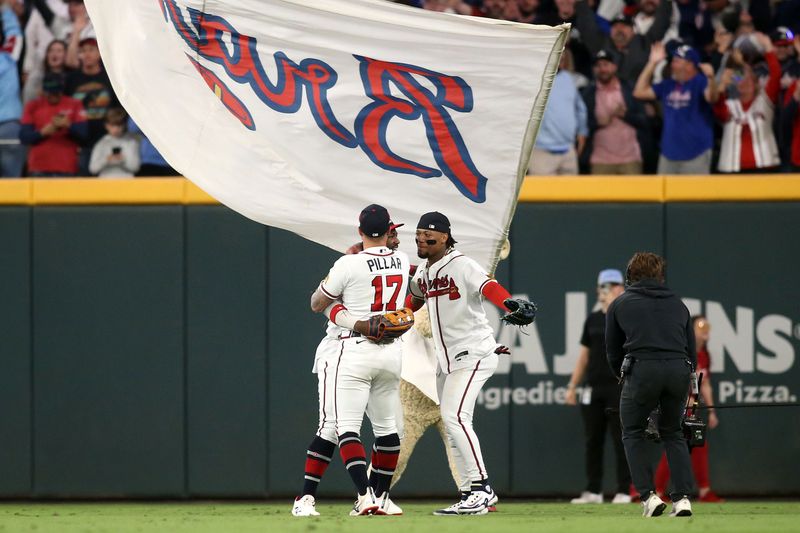 Oct 9, 2023; Cumberland, Georgia, USA; Atlanta Braves center fielder Michael Harris II (23) celebrates with left fielder Kevin Pillar (17) and right fielder Ronald Acuna Jr. (13) after the Atlanta Braves beat the Philadelphia Phillies in game two of the NLDS for the 2023 MLB playoffs at Truist Park. Mandatory Credit: Brett Davis-USA TODAY Sports