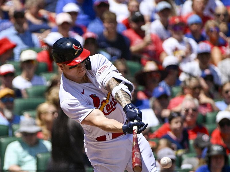 Jul 30, 2023; St. Louis, Missouri, USA;  St. Louis Cardinals left fielder Tyler O'Neill (27) hits a one run single against the Chicago Cubs during the first inning at Busch Stadium. Mandatory Credit: Jeff Curry-USA TODAY Sports