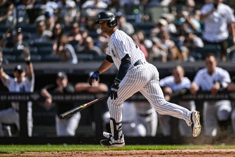 May 27, 2023; Bronx, New York, USA; New York Yankees center fielder Isiah Kiner-Falefa (12) hits a walk off RBI single in the tenth inning against the San Diego Padres at Yankee Stadium. Mandatory Credit: John Jones-USA TODAY Sports