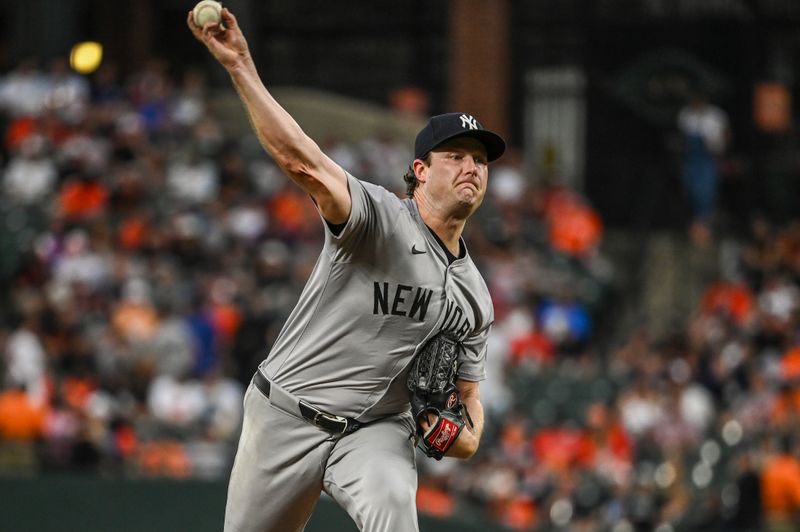 Jul 12, 2024; Baltimore, Maryland, USA; New York Yankees pitcher Gerrit Cole (45) throws a third inning pitch against the Baltimore Orioles  at Oriole Park at Camden Yards. Mandatory Credit: Tommy Gilligan-USA TODAY Sports