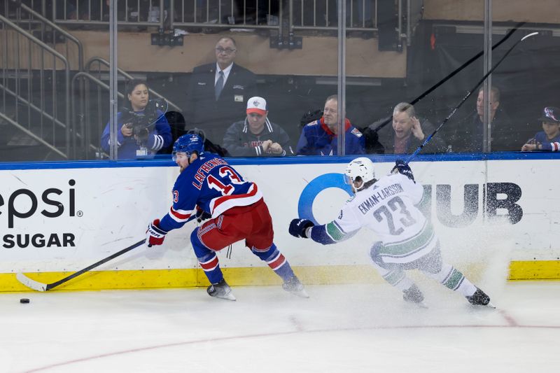 Feb 8, 2023; New York, New York, USA; New York Rangers left wing Alexis Lafreni  re (13) skates against Vancouver Canucks defenseman Oliver Ekman-Larsson (23) during the third period of a game at Madison Square Garden. Mandatory Credit: Jessica Alcheh-USA TODAY Sports