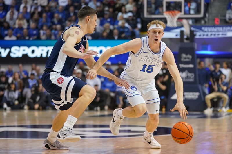 Jan 26, 2026; Provo, Utah, USA; BYU Cougars guard Richie Saunders (15) controls the ball during the first half against the Arizona Wildcats at Marriott Center. Mandatory Credit: Aaron Baker-Imagn Images 