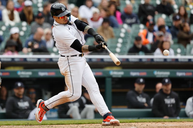 Apr 30, 2023; Detroit, Michigan, USA; Detroit Tigers shortstop Javier Baez (28) hits an RBI double in the fifth inning against the Baltimore Orioles at Comerica Park. Mandatory Credit: Rick Osentoski-USA TODAY Sports