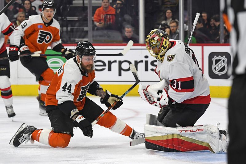 Mar 11, 2025; Philadelphia, Pennsylvania, USA; Ottawa Senators goaltender Anton Forsberg (31) makes a save as Philadelphia Flyers left wing Nicolas Deslauriers (44) looks on during the first period at Wells Fargo Center. Mandatory Credit: Eric Hartline-Imagn Images