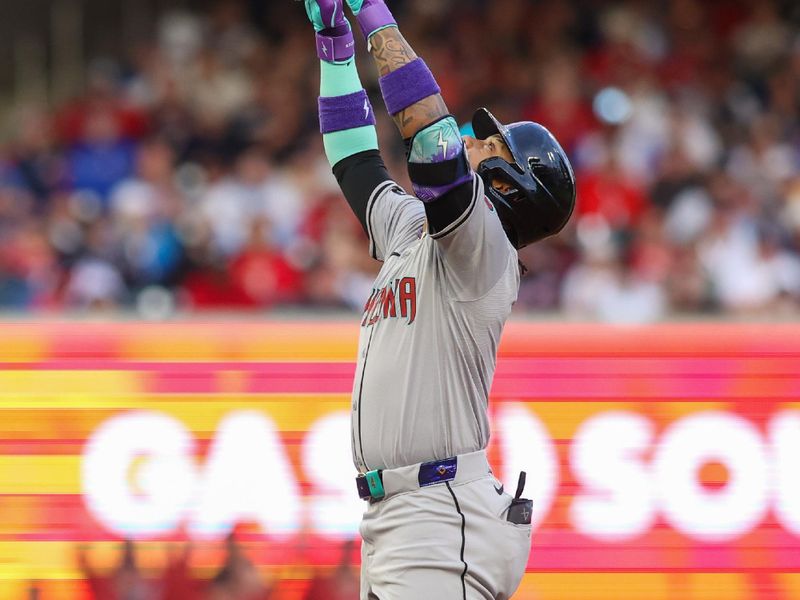 Apr 6, 2024; Atlanta, Georgia, USA; Arizona Diamondbacks second baseman Ketel Marte (4) reacts after a RBI double against the Atlanta Braves in the first inning at Truist Park. Mandatory Credit: Brett Davis-USA TODAY Sports