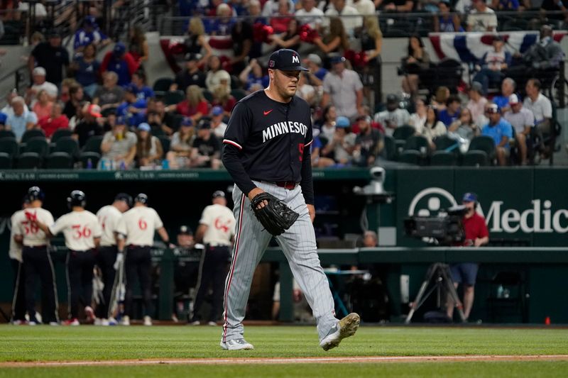 Aug 16, 2024; Arlington, Texas, USA; Minnesota Twins pitcher Caleb Thielbar (56) leaves the field after being taken out of the game during the sixth inning against the Texas Rangers at Globe Life Field. Mandatory Credit: Raymond Carlin III-USA TODAY Sports