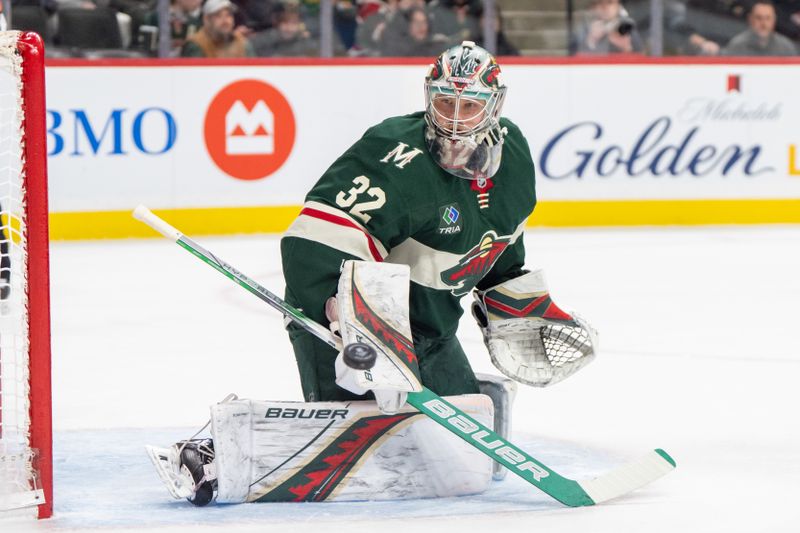 Mar 11, 2025; Saint Paul, Minnesota, USA; Minnesota Wild goaltender Filip Gustavsson (32) watches a shot go wide against the Colorado Avalanche in the first period at Xcel Energy Center. Mandatory Credit: Matt Blewett-Imagn Images