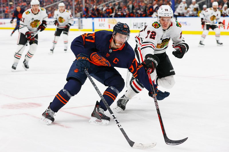 Jan 25, 2024; Edmonton, Alberta, CAN; Edmonton Oilers forward Connor McDavid (97) carries the puck around Chicago Blackhawks defensemen Alex Vlasic (72) during the third period at Rogers Place. Mandatory Credit: Perry Nelson-USA TODAY Sports