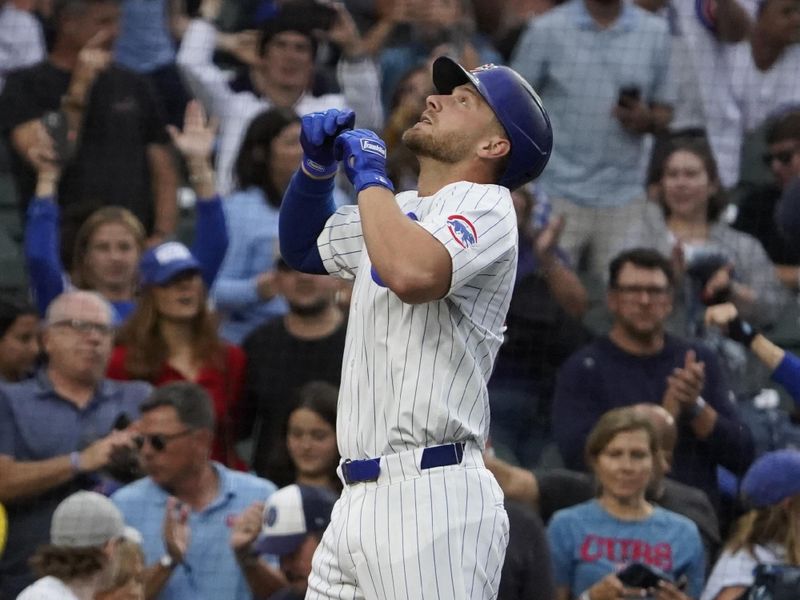 Sep 22, 2024; Chicago, Illinois, USA; Chicago Cubs first baseman Michael Busch (29) gestures after hitting a home run against the Washington Nationals during the fourth inning at Wrigley Field. Mandatory Credit: David Banks-Imagn Images