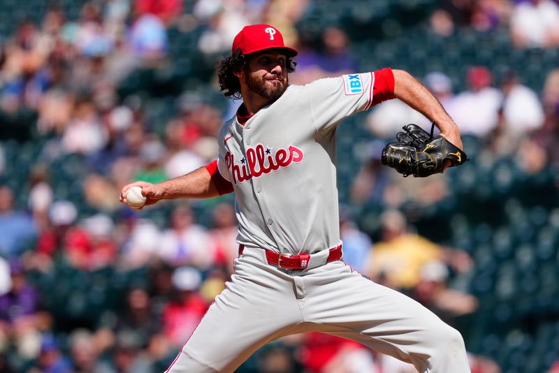 May 22, 2025; Denver, Colorado, USA; Philadelphia Phillies relief pitcher Jordan Romano  delivers a pitch in the ninth inning against the Colorado Rockies at Coors Field. Mandatory Credit: Ron Chenoy-Imagn Images