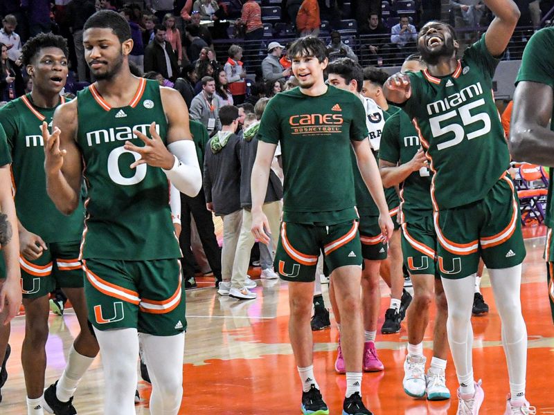 Feb 4, 2023; Clemson, South Carolina, USA; Miami forward AJ Casey (0) and Miami guard Wooga Poplar (55) celebrate with teammates after the game at Littlejohn Coliseum in Clemson, S.C. Saturday, Feb. 4, 2023. Miami won 78-74.   Mandatory Credit: Ken Ruinard-USA TODAY Sports