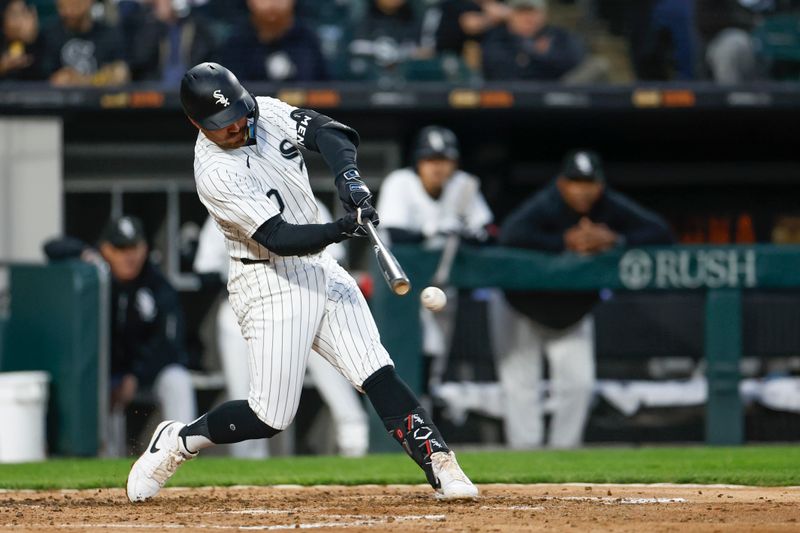 Apr 26, 2024; Chicago, Illinois, USA; Chicago White Sox shortstop Danny Mendick (0) doubles against the Tampa Bay Rays during the fourth inning at Guaranteed Rate Field. Mandatory Credit: Kamil Krzaczynski-USA TODAY Sports