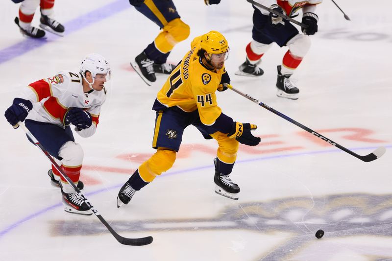 Mar 21, 2024; Sunrise, Florida, USA; Nashville Predators left wing Kiefer Sherwood (44) moves the puck past Florida Panthers center Nick Cousins (21) during the third period at Amerant Bank Arena. Mandatory Credit: Sam Navarro-USA TODAY Sports