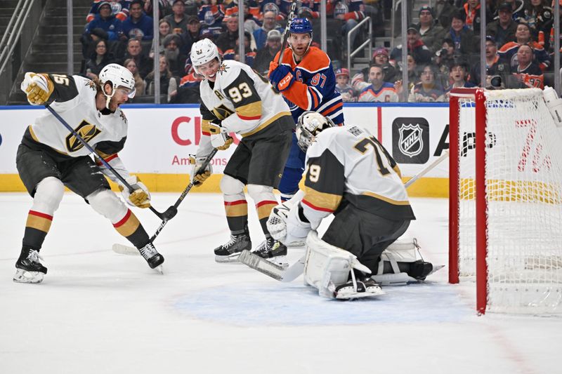 Dec 21, 2025; Edmonton, Alberta, CAN; Vegas Golden Knights (15) races towards Vegas Golden Knights right wing Mitch Marner (93) as he battles with Edmonton Oilers center Connor McDavid (97) in front of Vegas Golden Knights goalie Carter Hart (79) during the first period at Rogers Place. Mandatory Credit: Walter Tychnowicz-Imagn Images