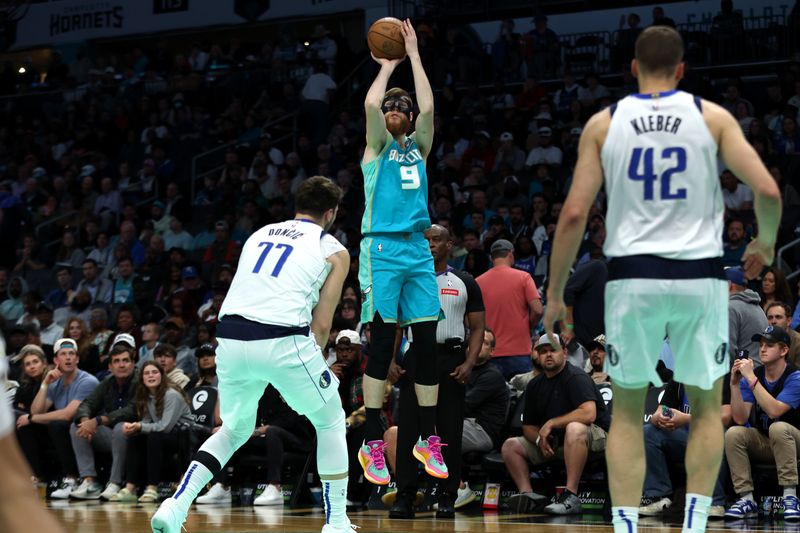 CHARLOTTE, NORTH CAROLINA - APRIL 09: Davis Bertans #9 of the Charlotte Hornets shoots a three pointer during the first half of an NBA game against the Dallas Mavericks at Spectrum Center on April 09, 2024 in Charlotte, North Carolina. NOTE TO USER: User expressly acknowledges and agrees that, by downloading and or using this photograph, User is consenting to the terms and conditions of the Getty Images License Agreement. (Photo by David Jensen/Getty Images)