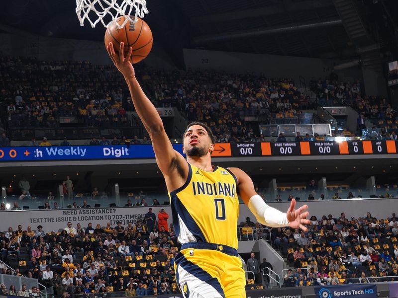 INDIANAPOLIS, IN - OCTOBER 27: Tyrese Haliburton #0 of the Indiana Pacers drives to the basket during the game against the Philadelphia 76ers on October 27, 2024 at Gainbridge Fieldhouse in Indianapolis, Indiana. NOTE TO USER: User expressly acknowledges and agrees that, by downloading and or using this Photograph, user is consenting to the terms and conditions of the Getty Images License Agreement. Mandatory Copyright Notice: Copyright 2024 NBAE (Photo by Ron Hoskins/NBAE via Getty Images)