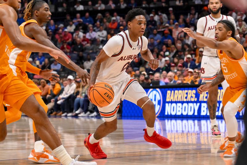 Mar 15, 2025; Nashville, TN, USA;  Auburn Tigers guard Tahaad Pettiford (0) drives to the basket against the Tennessee Volunteers during the first half at Bridgestone Arena. Mandatory Credit: Steve Roberts-Imagn Images