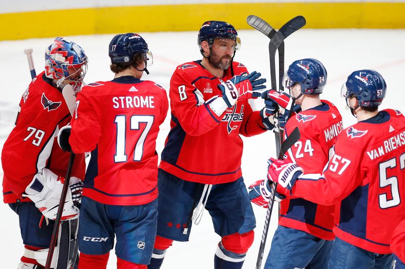 Nov 18, 2023; Washington, District of Columbia, USA; Washington Capitals left wing Alex Ovechkin (8) celebrates with teammates after defeating the Columbus Blue Jackets during the third period at Capital One Arena. Mandatory Credit: Amber Searls-USA TODAY Sports